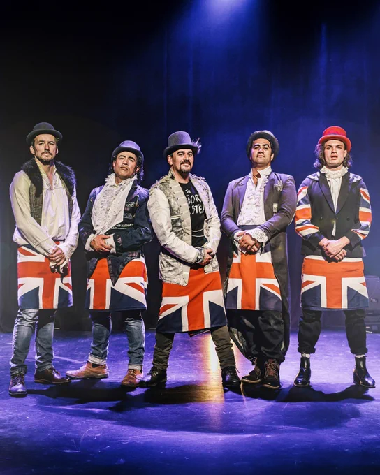 5 Men standing on stage, wearing bowler hats. The one on the far left is Cohen Holloway. - The Maori Side Steps