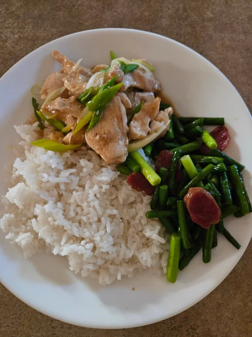 Dinner as described served on a round white soup plate.