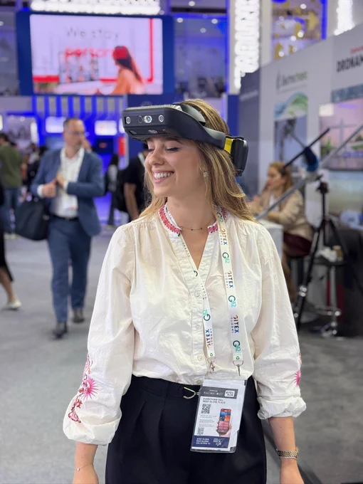A young woman, eyes-closed, wearing .lumen glasses is smiling big while testing them at a tech event. ​

Text on image: ​

The smile of freedom.​

Our haptic feedback is hard to explain in words, but so intuitive, it just makes you smile.​

Every test reminds us why we build: to give 338 million people independence.​