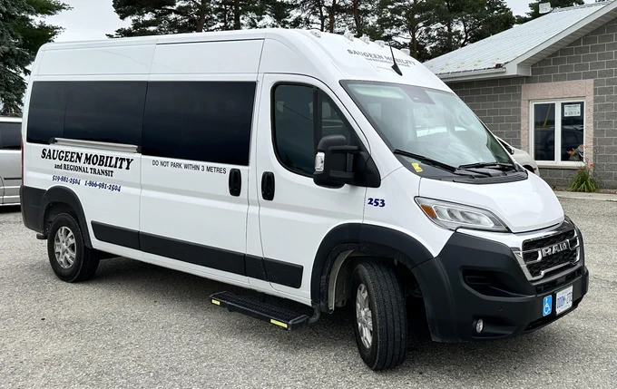 White accessible van parked outdoors.