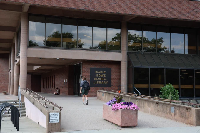 student walking into Howe Library