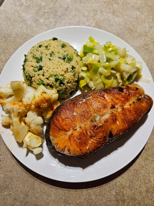 Dinner as described served on a round white plate