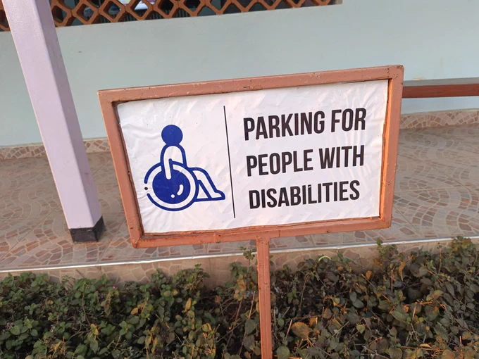 Sign post reading "Parking for People with Disabilities"