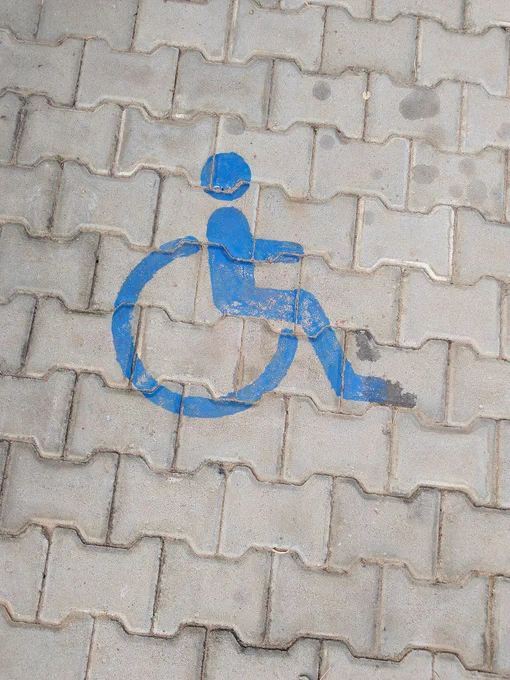 Drawing of a wheelchair sign on the floor