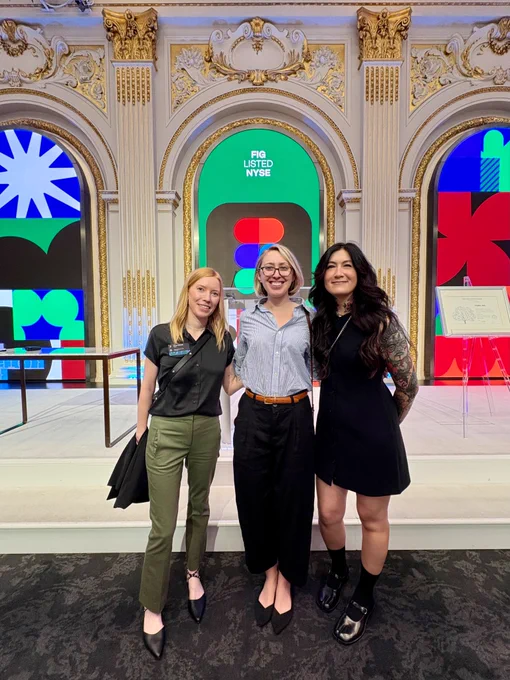 Jenn Yee, Jules Forrest, and me in front of the podium in the NYSE boardroom.