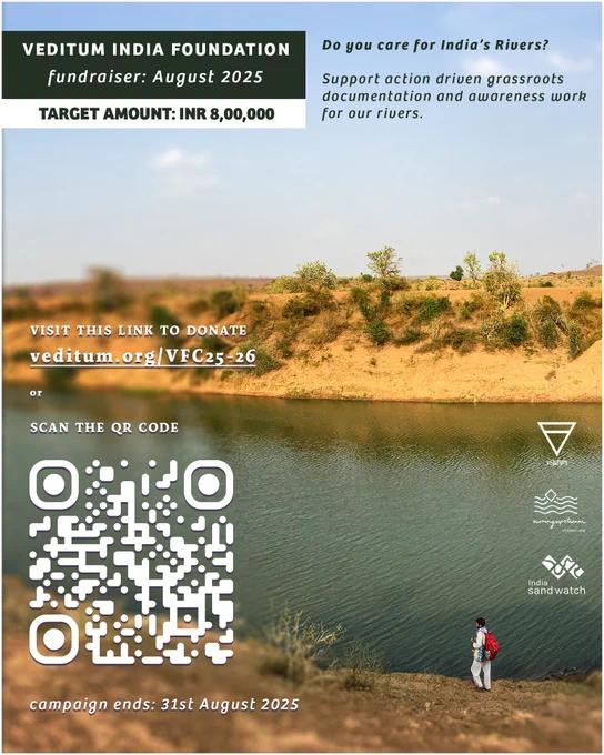 Poster inviting contributions to the annual fundraising campaign by Veditum India Foundation. The link to donate is: veditum.org/VFC25-26

The poster has an image in the background that shows a man in white clothes carrying a red bag, walking along the banks of a river. The river is running across the screen in the bottom half of the poster, with a little bit of the near bank visible. The banks are made up of ochre yellow lose soil, with sparse vegetation but some huge trees are present.