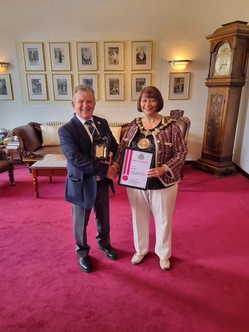 Alan Bent receiving the award from the Ceremonial Mayor of Salford, Councillor Heather Fletcher in the Mayor's Parlour.