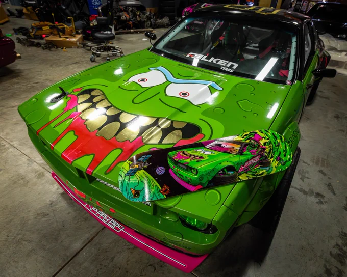 Pickle Rick skate deck laying on Pickle Rick!