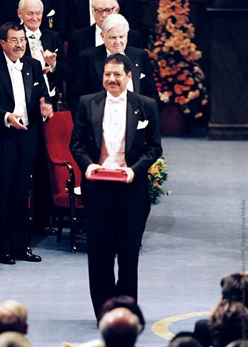 Ahmed Zewail at the Nobel Prize award ceremony in Stockholm on 10 December 1999. He is holding his Nobel Prize.