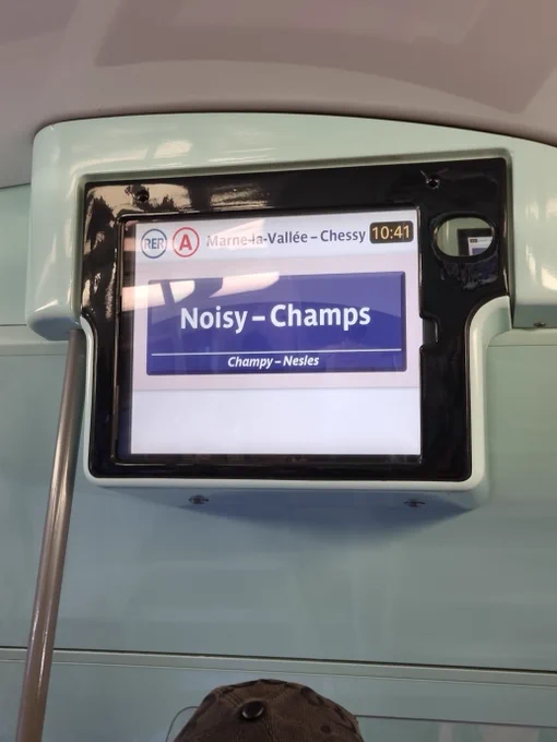 Paris train screen says "Noisy - Champs"