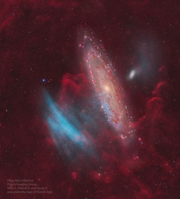 A stunning image of the Andromeda Galaxy (M31) with gigantic blue arcs, dubbed SDSO 1, spanning nearly the same angular size as M31 itself.