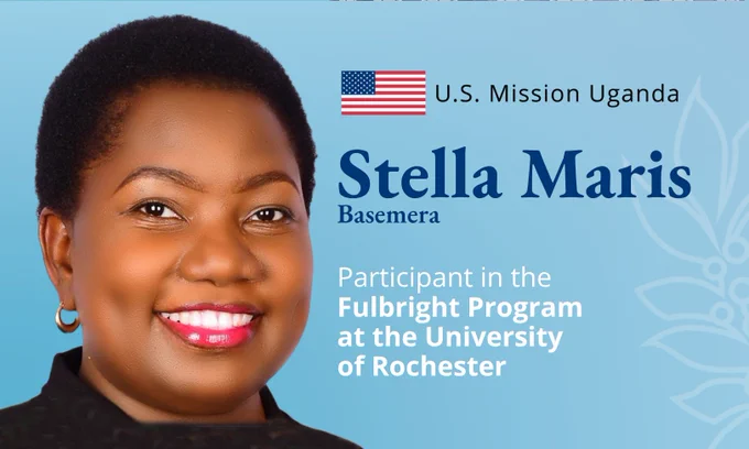Photo of Stella Maris Basemera, Participant in the Fulbright Program at the University of Rochester. U.S. Mission Uganda with a U.S. flag.
