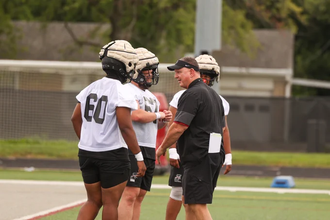 UIndy Football Head Coach Chris Keevers talks to his players on the first day of practice for the 2025 season. 
