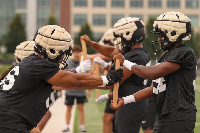UIndy football players in a drill on the first day of practice for the 2025 season.