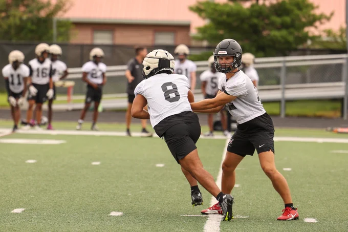 UIndy football players in a drill on the first day of practice for the 2025 season.