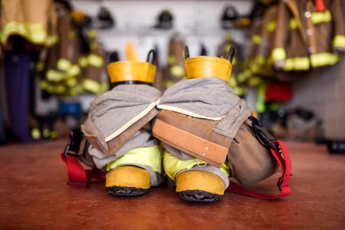 A firefighter's boots and overalls