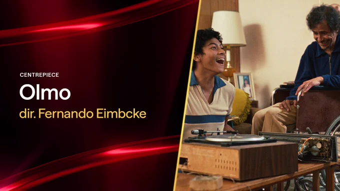 A graphic containing a film still from OLMO. A young man and an older gentleman in a wheelchair sit by a record player in a living room. The young man smiles widely and faces another man who can be seen from the backview. The graphic reads: "Centrepiece, Olmo, dir. Fernando Eimbcke"