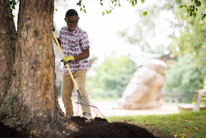 A student in the OVR MY Work program is adding new mulch at Overlook Park in Lancaster County.