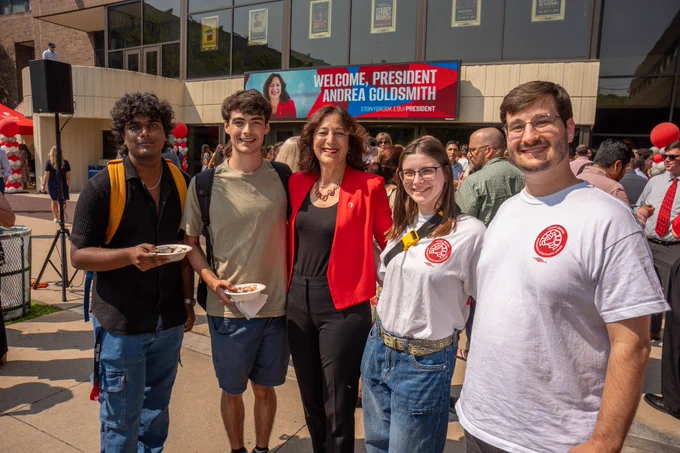 Me in a group shot with some students. Two are holding ice cream.