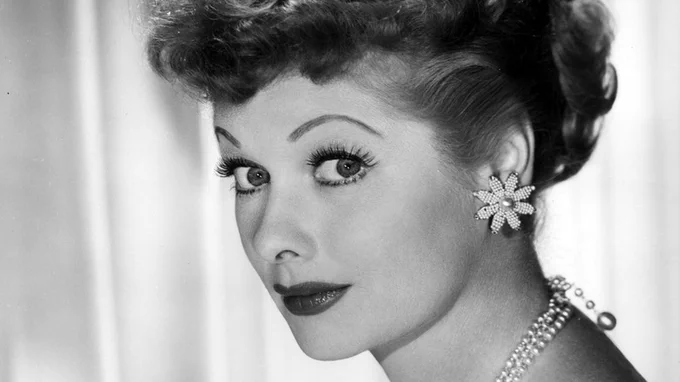 A black and white headshot of Lucille Ball in her younger days.