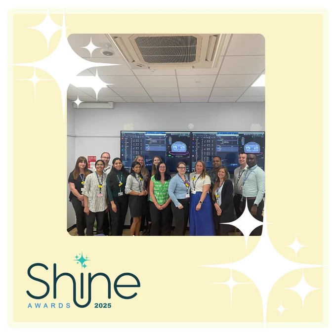 The Radiotherapy Physics team poses together in front of large display screens showing radiotherapy software. The group is smiling and standing in a clinical room, framed by a pale yellow border with sparkles and the Shine Awards 2025 logo in the corner.