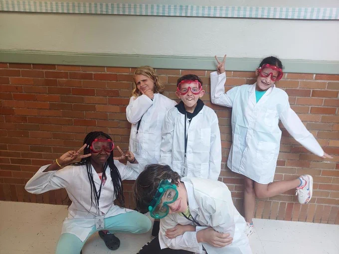 Students being silly while showing their lab safety gear! 