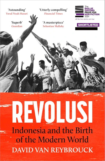 Book cover.  Black and white top half is a photograph of maybe a dozen people at a rally, with arms and flags raised, with some short blurbs. "Astounding" (Yuva
l Noah Harari.  "Utterly compelling" (Financial Times).  "Superb" (Guardian).  "
A masterpiece" (Sebastian Mallaby).  Bottom is red with large white title "REVOLUSI", smaller black subtitle "Indonesia and the Birth of the Modern World" and white author "DAVID VAN REYBROUCK".