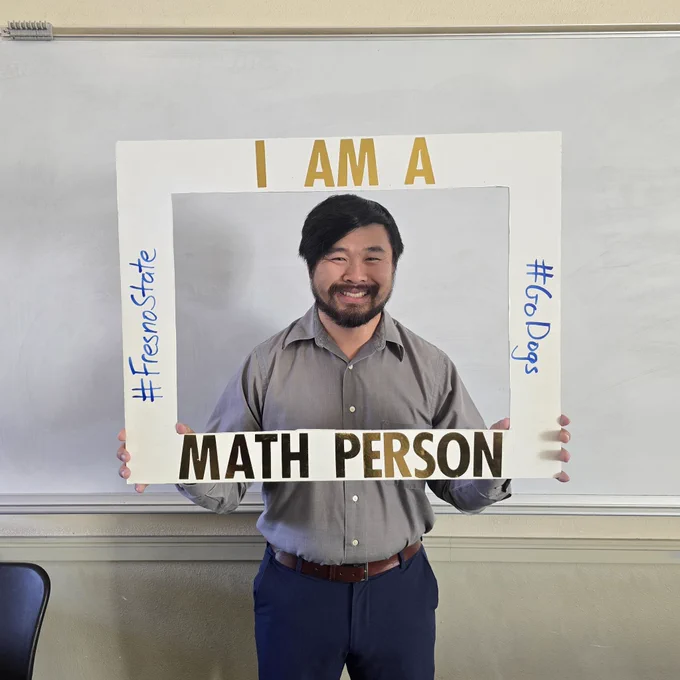 A picture of me with a frame that says "I am a math person"