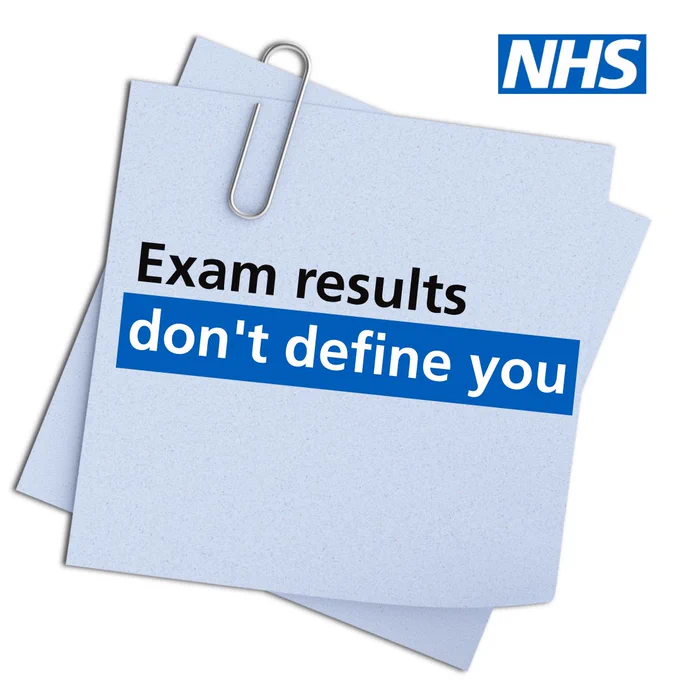 A post it note with the copy: 'Exam results don't define you'