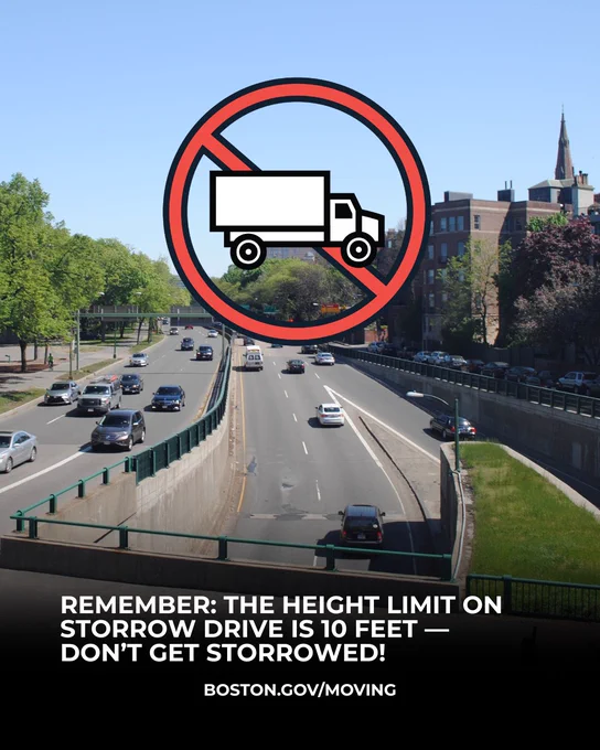 Storrow Drive on a summer day with an icon of a truck crossed out on top
