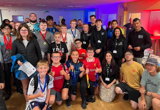 A large group of young people standing together.