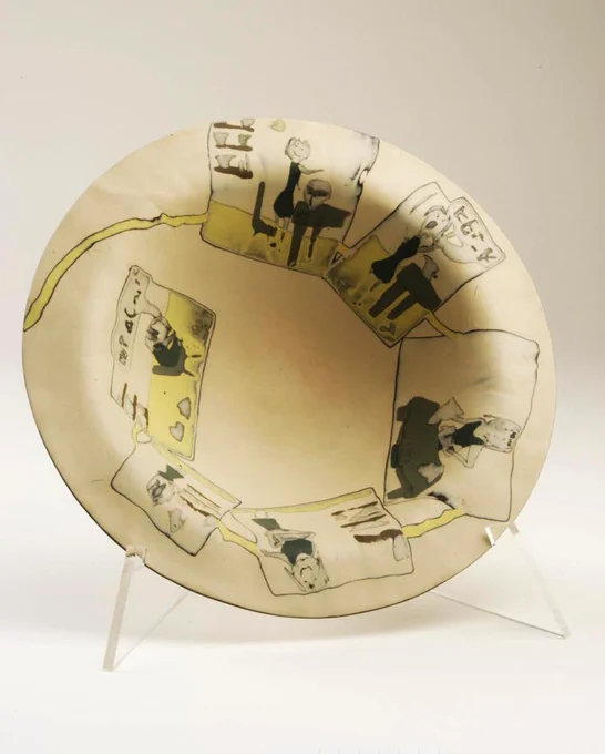 Beige bowl with various illustrations on