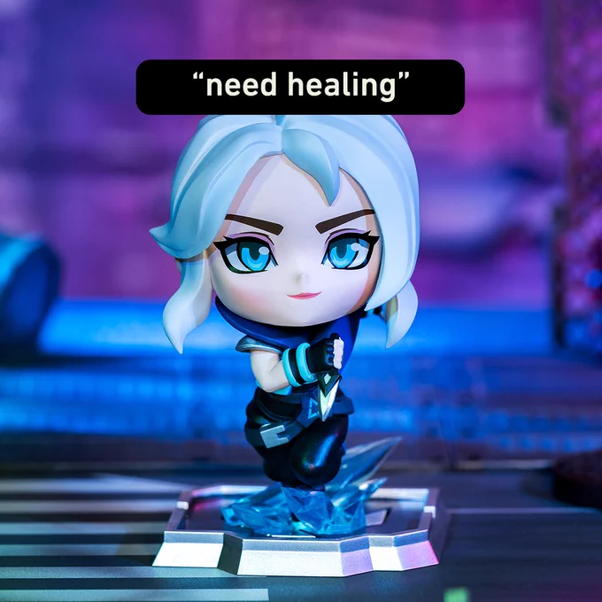 [Jett Figure] - Here you see a chibi-style Jett figure running facing forward. She is holding one of her knives and appears to be in an urban setting at night. 