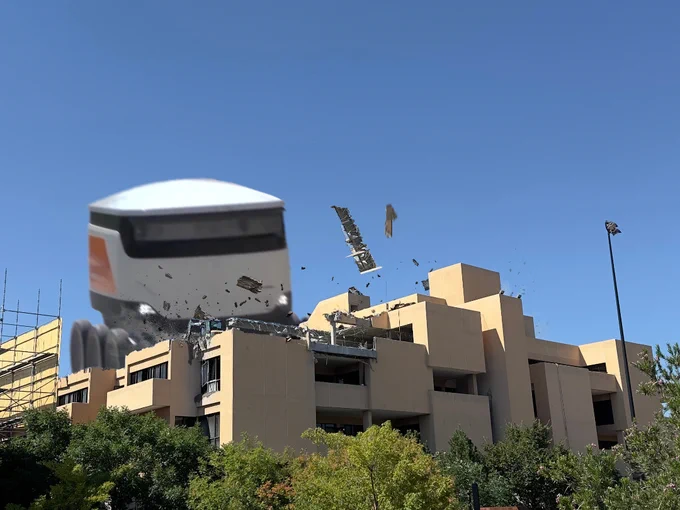 Photoshopped image of a good delivery robot driving into the humanities building.