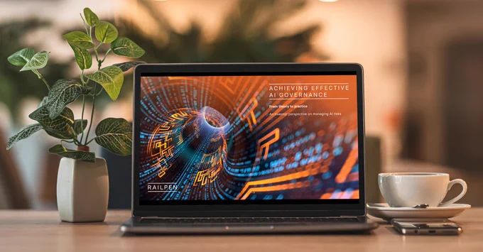 Image shows the front cover of Railpen's report: Achieving Effective AI Governance. The image is of a digital setting with the title of the report overlaid.