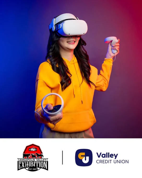Youth in a yellow sweater wearing a Meta VR Headset with the logos, Annapolis Valley Exhibition and Valley Credit Union