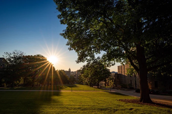 Bascom Hill, with Library Mall and the Wisconsin State Capitol Building in the distance, is pictured during sunrise.