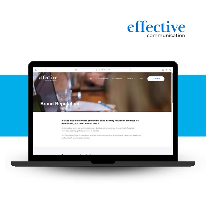 A laptop showcasing the Effective website in front of a blue rectangle. 