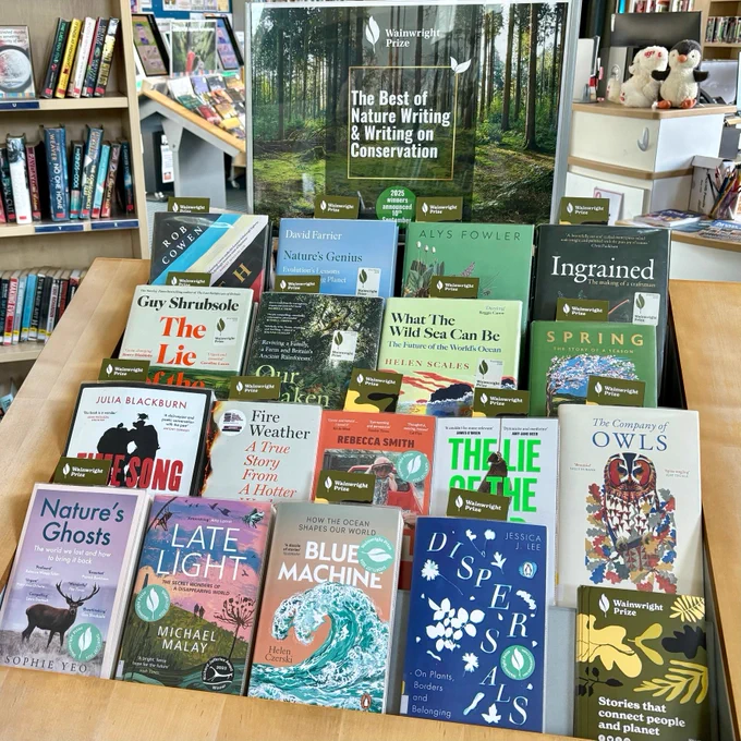 A display at Ash Library, headed by a green poster reading 'The Best of Nature Writing and Writing on Conservation'. Underneath are four rows of books nominated for the Wainwright Prize.
 