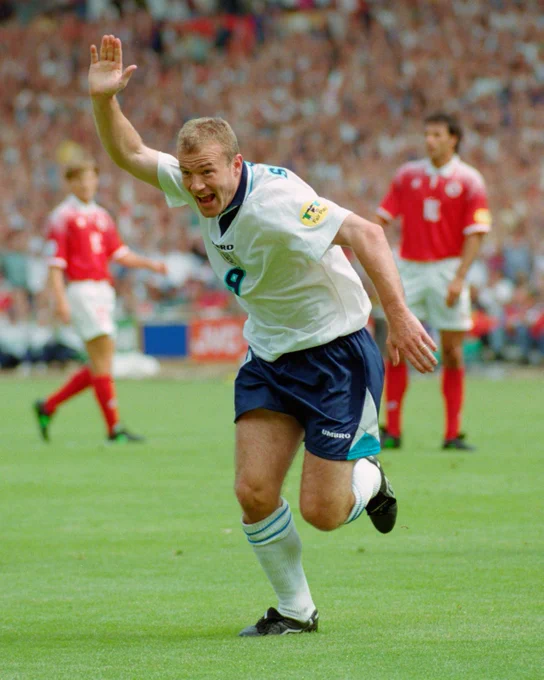 Alan Shearer celebrates while playing for England
