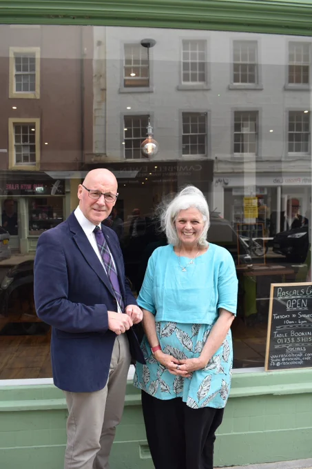 First Minister John Swinney with Dodie Piddock,
the Chief Executive of the Rascals Cafe in Perth.
