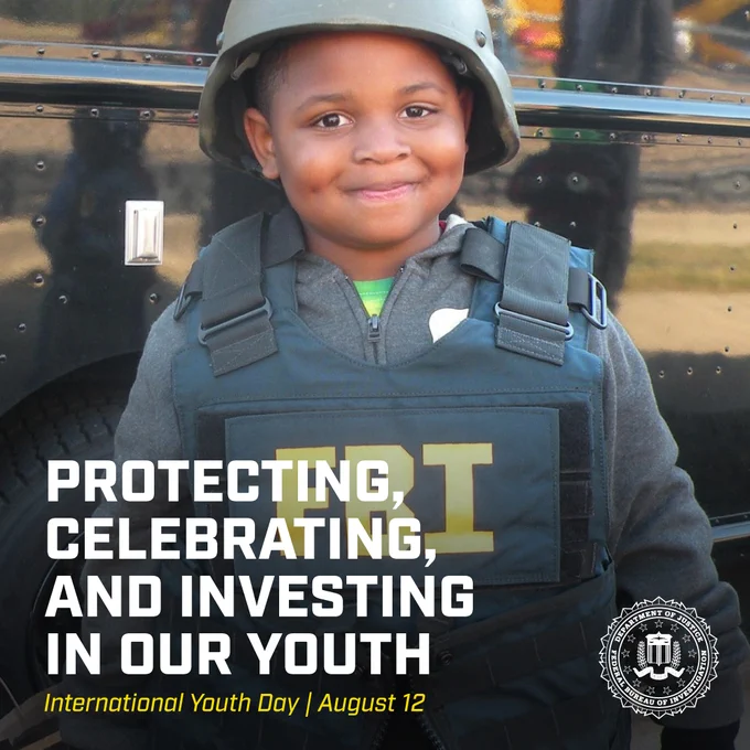 Child wearing FBI tactical vest and helmet standing in front of a black vehicle, symbolizing youth empowerment and protection. The FBI seal is featured in the corner.