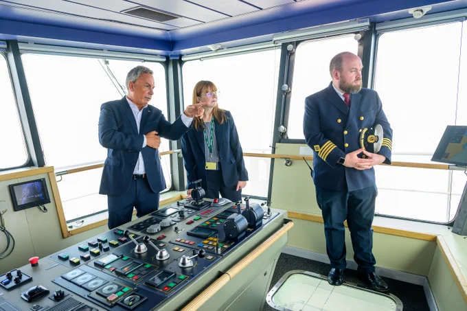 Pictured on bridge area of the vessel with a control panel are (L-R) Paul Grant, Trade Director-Irish Sea, Stena Line, Economy Minister Dr Caoimhe Archibald and David Howie, Senior Master, Superfast VII. 