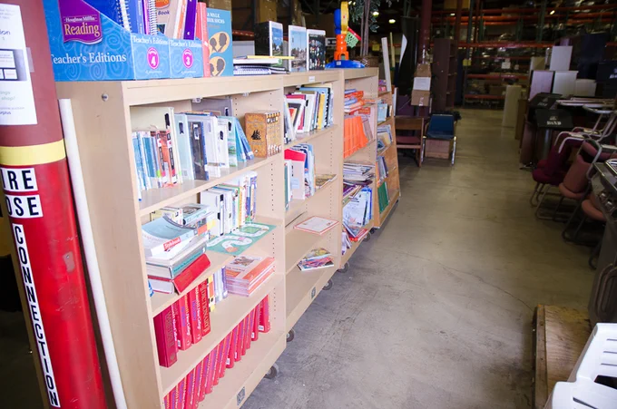 Surplus books on a shelf.