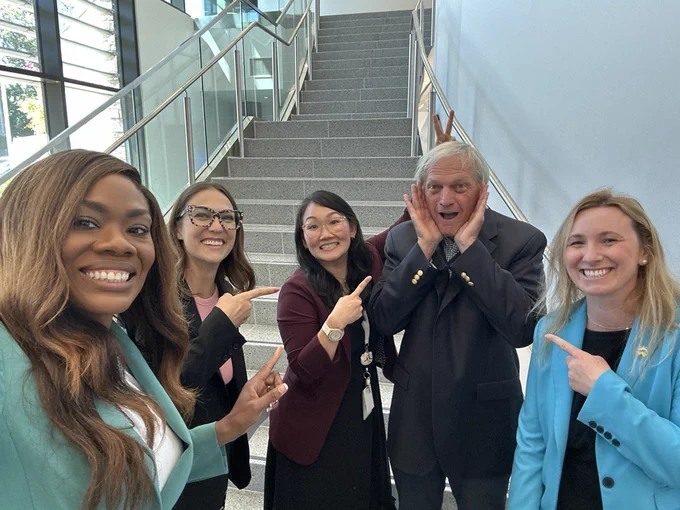 Supervisor Shanelle Scales-Preston (left) poses for selfie with Congressman Mark DeSaulnier (second from right) and others in the Contra Costa County Administration Building in Martinez.