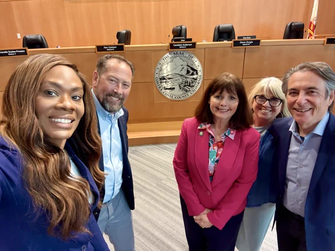 From left to right: Supervisor Shanelle Scales-Preston, Supervisor Ken Carlson, Board Chair Supervisor Candace Andersen, Vice Chair Supervisor Diane Burgis, and Supervisor John Gioia pose for a selfie in Board Chambers in Martinez, California, on Tuesday, August 12, 2025.