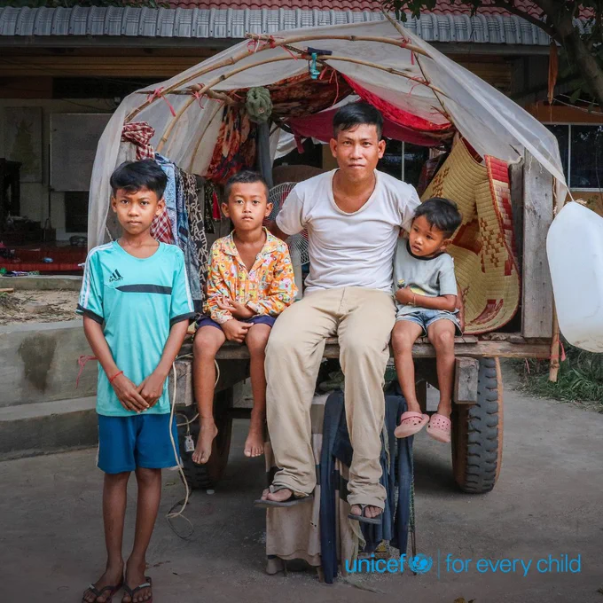 Ourd Khun, 30, a farmer from Oddar Meanchey living just 2km from the border, clutches his three sons and nephew after weeks away from home. Missing from the photo are his two daughters—an eight-month-old asleep in her mother’s arms and a six-year-old resting nearby. Since the family fled, his crops have gone untended and livestock unfed. Even with the journey home ahead, uncertainty still shadows their nights.

Many Cambodian families and children, like Ourd’s, are still at risk. The recent crisis has left thousands in urgent need, facing disrupted access to clean water, interrupted education, and heightened risks of violence and exploitation.
