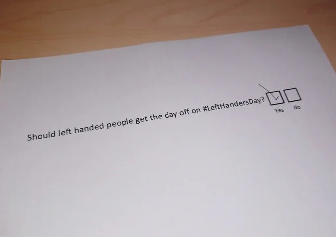A questionnaire with the question 'Should left handed people get the day off on Left Handers Day?' The Yes box is ticked with a backwards left handed tick.