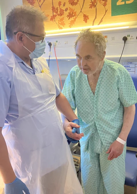 Nurse helping a patient walk