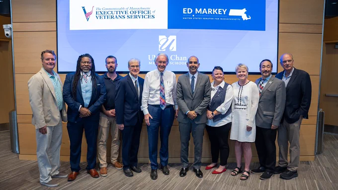 Participants in the roundtable discussion at UMass Chan Medical School pose for a photo after